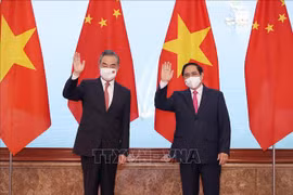 越南政府总理范明政会见中国国务委员、外交部长王毅