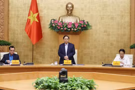 越南政府总理范明政主持政府与工会工作关系会议