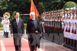 越南国家主席陈大光和伊朗总统哈桑·鲁哈尼（图片来源：越通社）