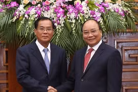 越南政府总理会见老挝计划投资部部长（图片来源：越通社）
