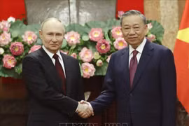 2024 年 6 月，苏林主席与俄罗斯联邦总统弗拉基米尔·普京合影。图自越通社