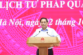 政府总理范明政发表讲话。图自越通社