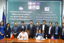 越南通讯社与柬埔寨国家通讯社新阶段合作协议签署仪式。图自越通社