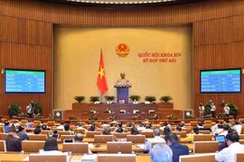 越南第十四届国会第七次会议：表决通过两项决议 讨论两部法案