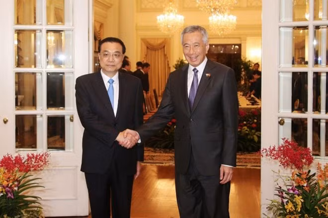 中新两国总理举行会谈 双方签署11项合作备忘录 ảnh 1