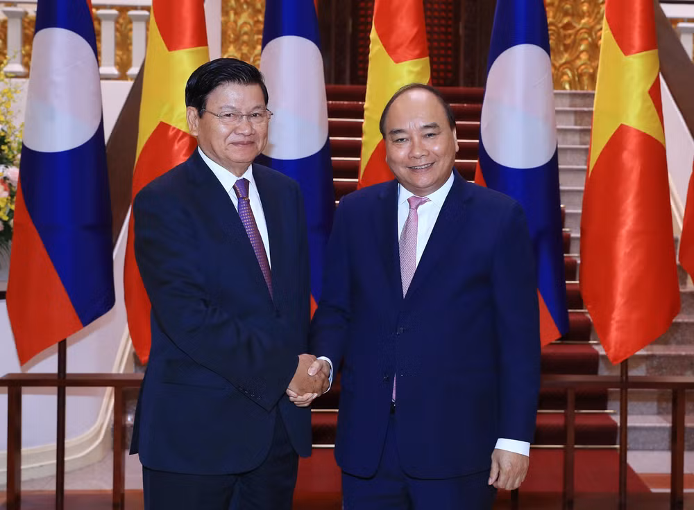 WEF ASEAN 2018: 政府总理阮春福会见老挝总理通伦·西苏里 ảnh 1 WEF ASEAN 2018: 政府总理阮春福会见老挝总理通伦·西苏里 ảnh 1