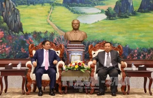 老挝人革党中央总书记、国家主席本扬•沃拉吉会见越共组织部高级代表团 ảnh 1 老挝人革党中央总书记、国家主席本扬•沃拉吉会见越共组织部高级代表团 ảnh 1
