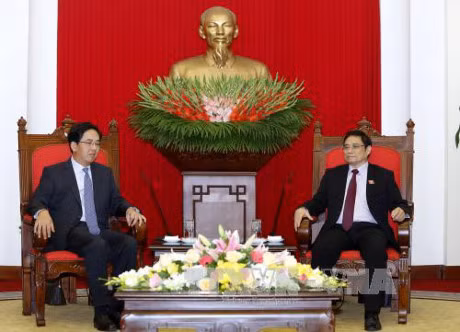 越共中央组织部部长范明正会见中国驻越大使洪小勇 ảnh 1