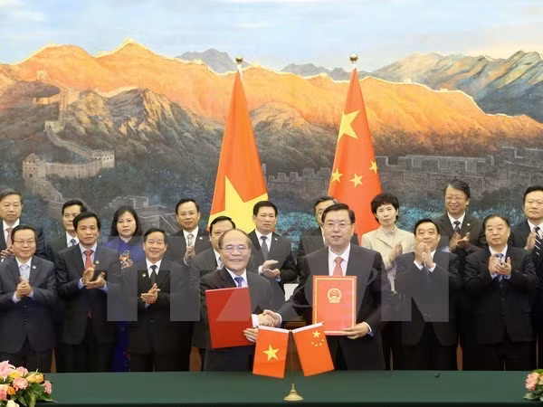 越南国会主席阮生雄访华：促进越中政治互信 ảnh 1