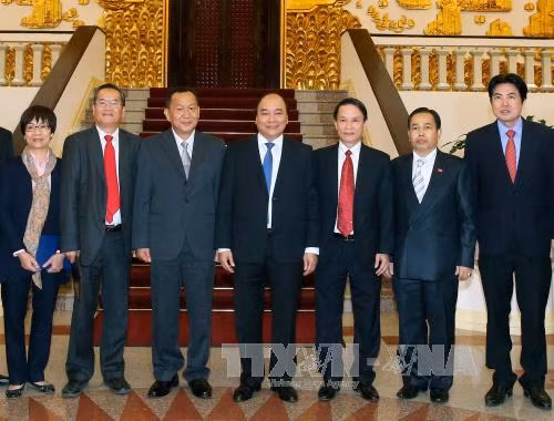 越南政府总理会见老挝巴特寮通讯社社长 ảnh 2