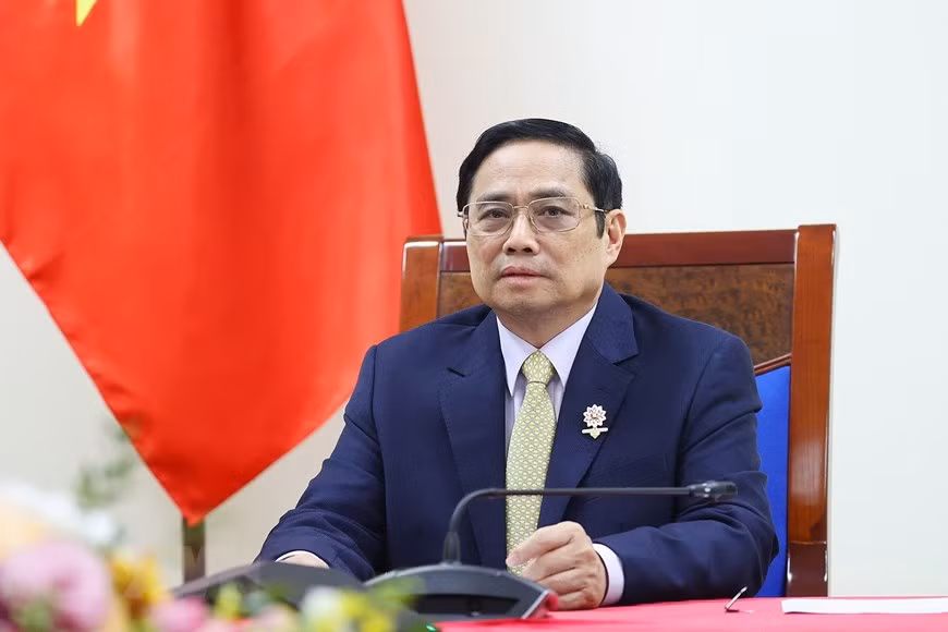 越南政府总理范明政与英国首相约翰逊通电话 ảnh 1