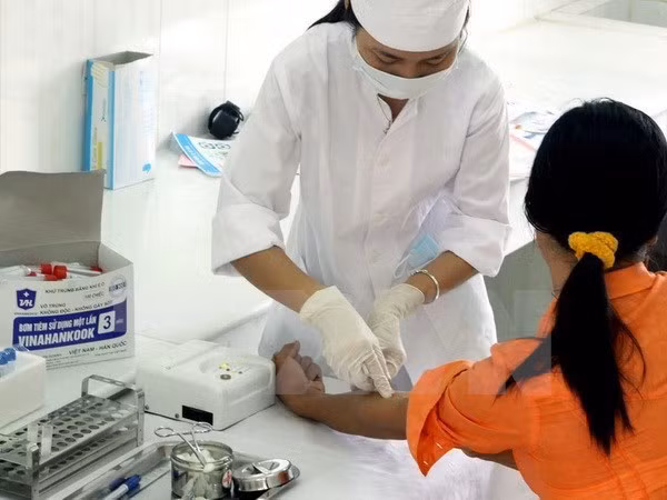 山罗省确保少数民族同胞能使用医疗保险卡看治病 ảnh 1