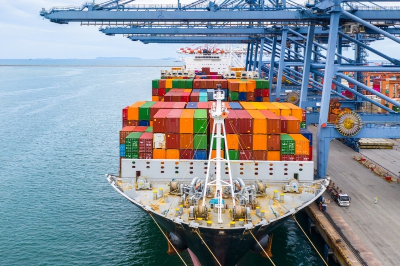 Container ship at port terminal