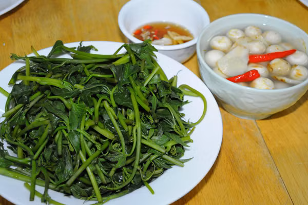 越南美食反映越南民族的哲学道理和人生观 ảnh 1