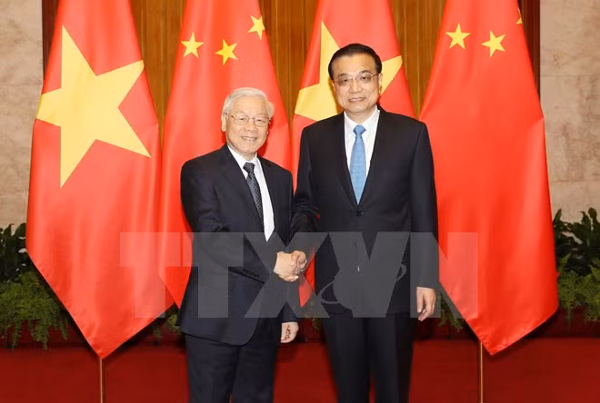 越共中央总书记阮富仲会见中国国务院总理李克强 ảnh 1
