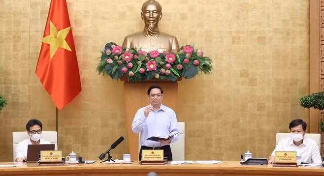 政府总理范明政：需加快治疗新冠病毒药物的研发和生产进度 ảnh 1