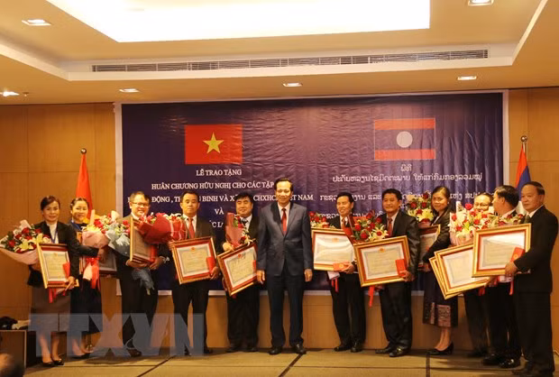 加大越老两国在劳动与社会福利领域的合作力度 ảnh 1