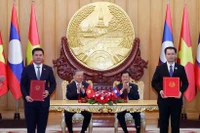 越老签署发展产业链合作谅解备忘录。图自越通社