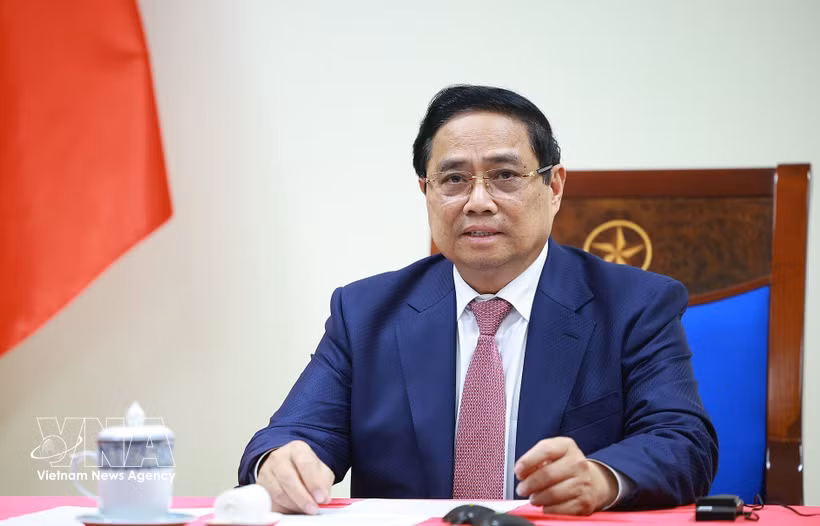 越南政府总理范明政与安哥拉总统洛伦索通电话 。图自越通社