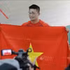 越南选手何明成破纪录夺金。图自越通社