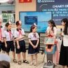 胡志明市第十二郡张定小学组织“在五年级学生英语教学中应用AI”专题研讨会。图自越南人民报