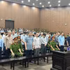 被告们聆听法庭宣判。图自越通社