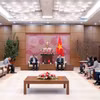 越南国会秘书长、国会办公厅主任黎光孟与约旦众议院秘书长阿瓦德•A•O•阿勒古韦里举行工作会议。图自人民代表报