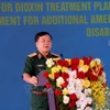 越南战后炸弹地雷及化学毒剂处理国家指导委员会常设机构主任黄春战上将发言。图自越通社