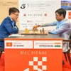 越南棋手黎光（左图）击败印度头号种子拉梅什巴布·普拉格纳南达赢得冠军。图自互联网