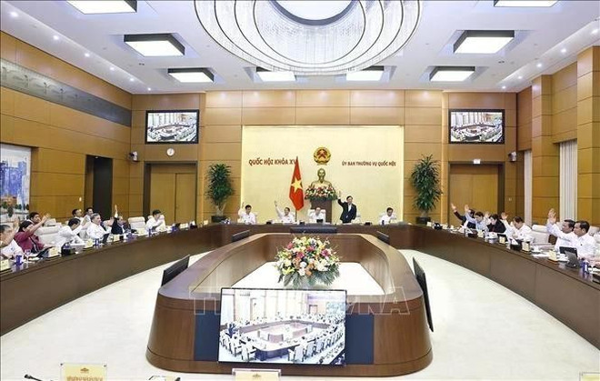 国会常务委员会委员表决。图自越通社 uuid317c1e2a-95bb-441b-a76e-cca5a796f767code001library1type1mode1loctruecaptrue.jpg