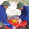 搜寻归集在老挝牺牲的72具越南志愿军和专家烈士遗骸。图自越通社