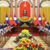越南国家主席梁强会见老挝总书记、国家主席通伦·西苏里。图自越通社