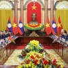 越南国家主席梁强会见老挝总书记、国家主席通伦·西苏里。图自越通社