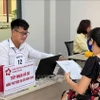 自7月31日起，胡志明市公共行政服务中心的各个基层工作组（每组5人）已进驻38个乡、坊办理跨区行政手续。图自越通社