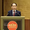 司法部部长黄青松就《法律普及教育法（修正案）》以及《国家赔偿责任法若干条款修改补充法》草案作了呈文和报告。图自越通社