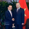 越共中央总书记、国家主席苏林会见新加坡国会议长谢健平。图自越通社