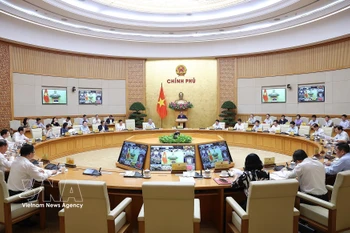 越南政府3月份例行会议和政府与各地方视频会议。图自越通社
