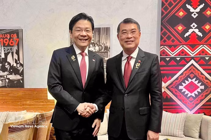 越南政府总理黎明兴会见新加坡总理黄循财 图自越通社
