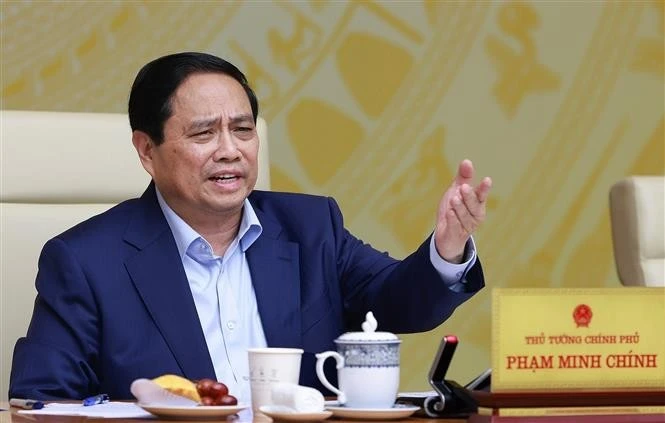 范明正总理主持召开2025年经济增长情景全国视频会议。（图片来源：越通社）