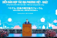 范明政总理出席越日地方合作论坛。图自越通社