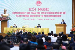 越南政府总理范明政主持关于实现经济两位数增长会议。图自越通社