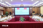 双方会谈现场。图自越通社