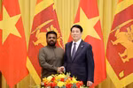 国家主席梁强与斯里兰卡总统迪萨纳亚克亲切握手。图自越通社