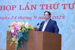 范明政在会上发表讲话。图自越通社