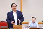 范明政总理在会上发表讲话。图自越通社