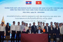 越老两国跨部门协调组代表签署工作会议纪要。图自工贸部