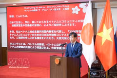 越南驻日本大使馆一等秘书、劳务管理委员会主任潘进黄发表讲话。图自越通社