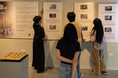 展览汇聚了九位来自国内外摄影师的作品。图自人民报