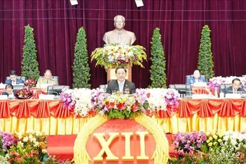 老挝人民革命党第十二次全国代表大会开幕式现场。图自越通社