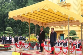 苏林总书记主持仪式 欢迎古共中央第一书记、古巴国家主席迪亚斯-卡内尔访越。图自越通社